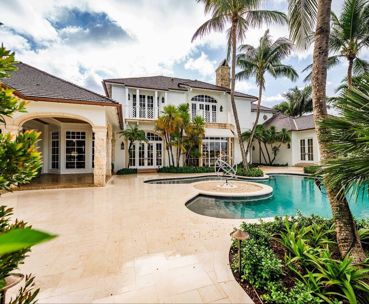 Custom pool and spa with landscape enhancements along waterfront property in Boynton Beach, FL