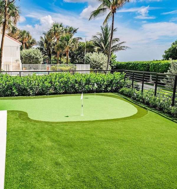 Luxury backyard putting green and tropical estate landscape in Boca Raton FL-2-1